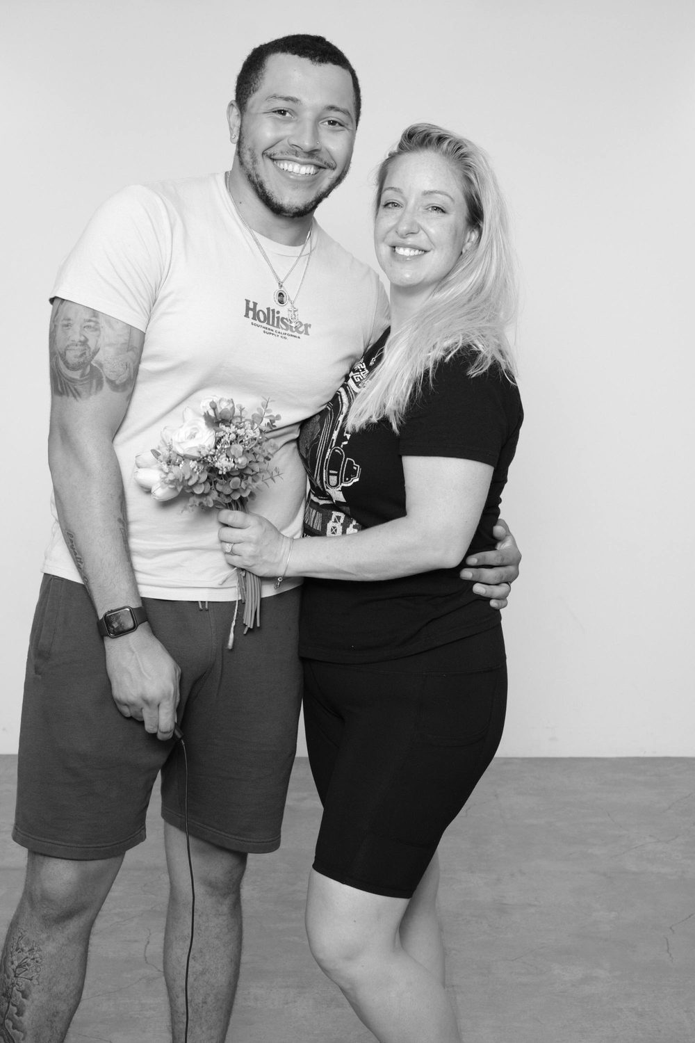 Jenniffer and Stephen, owners of The Match & Mirror, smiling together with a bouquet in Hiroshima, Japan