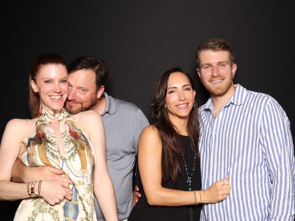 Two couples posing against a black backdrop at the FACT4Autism gala photo booth at The Dome in Virginia Beach