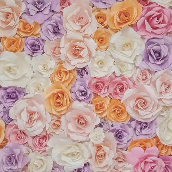 Wall of oversized lilac, peach, pink, and cream roses