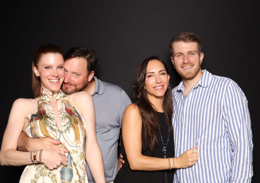 Two couples posing at the FACT4Autism gala photo booth at The Dome in Virginia Beach