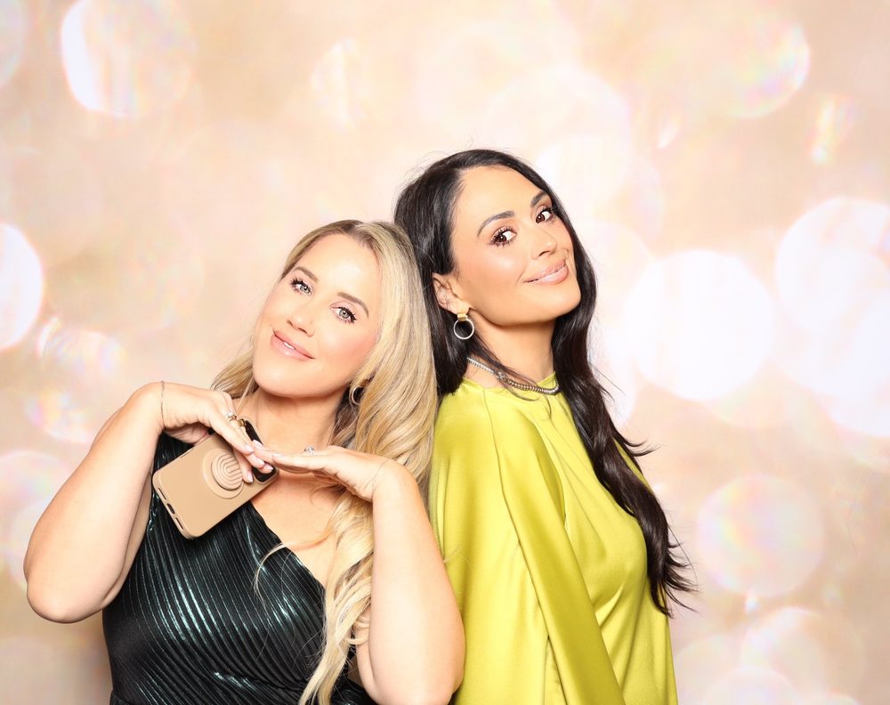 Two women posing at the VBSPCA gala photo booth in Virginia Beach