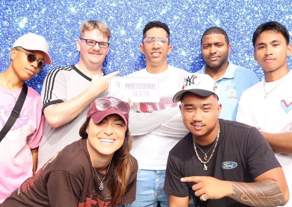 USS Eisenhower crew members posing at a Topgolf event photo booth in Virginia Beach