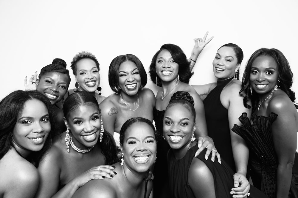 A bride with her bridesmaids at an editorial wedding photo booth in Hampton